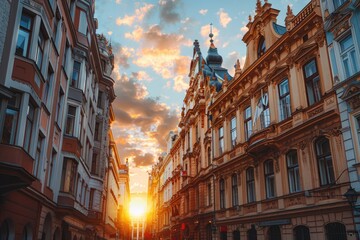 Obraz premium Sunset shines through historic European street with ornate buildings and beautiful sky, creating a warm and picturesque scene.