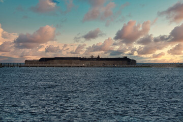 National Historic landmark of Fort Sumter from ocean view during sunset or sunrise