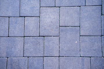 Close-up of stone bricks texture, showcasing rough, uneven surfaces with natural color variations and distinct mortar lines, ideal for backgrounds, architecture, or rustic designs.

