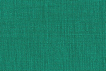 Fototapeta premium Textured yoga mat in a vibrant turquoise color, showcasing a woven pattern with small, raised dots.
