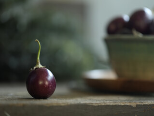 baby eggplant on rustic table