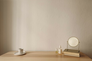 Cosmetic products and golden make up mirror on wooden table. Unrecognizable bottles mockups with blank labels. Perfume, serum and samplers. Beauty concept. Cup of tea, coffee. Skin care routine.