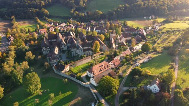 Aerial drone shot circling over the historic medieval village and monastery of Bebenhausen