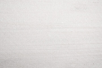 Monochrome, Light grey fine rough stone wall with surface line scratched for abstract background and texture, interior or exterior design. Beautiful patterns, space for work, banner, wallpaper.