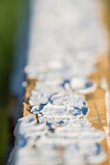 old, cracked paint on a wooden surface
