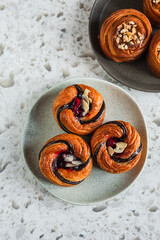 Cruffins with cherry filling and salted caramel on a plate