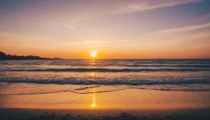 Soft Blue Waves on a Sandy Beach at Sunset