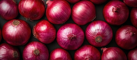 Pile of fresh red onions as background. Red onions close-up