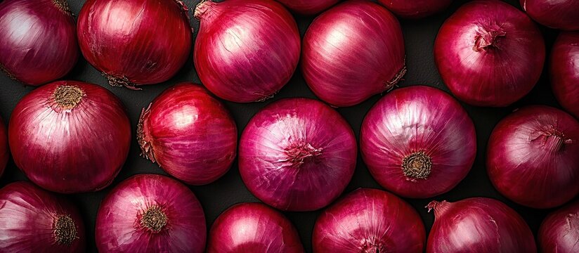 Pile of fresh red onions as background. Red onions close-up
