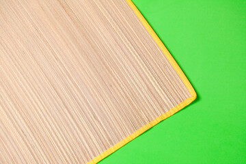 Straw mat on green background. Straw mat concept. Vintage concept. space for text.