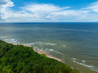 Aerial view of calm and wild Saka beach with a clear blue water on a sunny summer day. Beautiful...