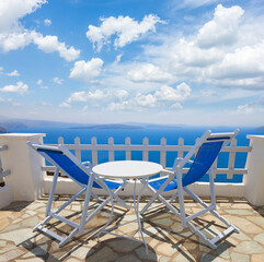 relaxing chairs with view of caldera, Santorini, Greece