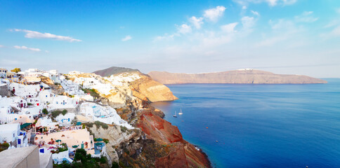 Naklejka premium view of volcano caldera with colorful houses of Oia, Santorini island, Greece