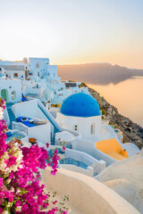 Naklejka premium traditional greek village Oia of Santorini, with blue domes of churches and village roofs, Greece