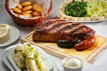Venezuelan grilled beef with arepas, yuca and heart of palm salad