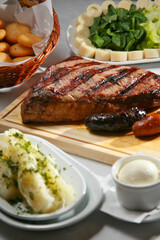 Venezuelan grilled beef with arepas, yuca and heart of palm salad