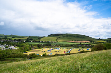Campsite in the rolling countryside landscape at Bridport in Dorset, England