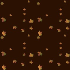 Colorful autumn leaves scattered on a dark background during the fall season