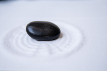 a stone in a zen garden, peaceful