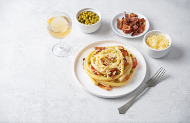 Fried bacon green peas pasta in a plate