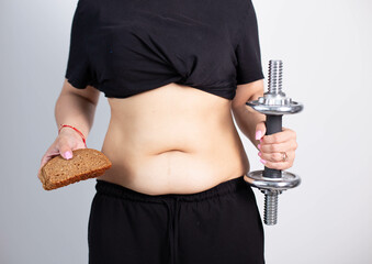 Women body fat belly. Obese woman hand holding excessive belly fat.