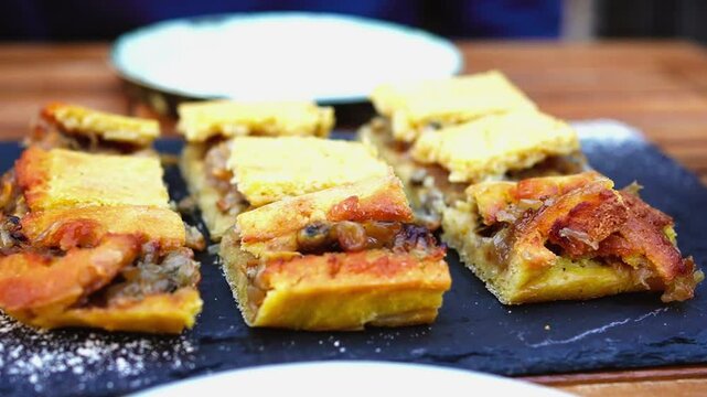 Empanada de millo de zamburi&ntilde;as (Galician queen scallop empanada made with corn dough) at restaurant in Vigo, Spain