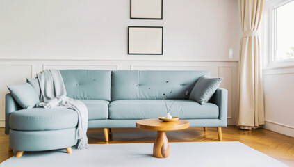 Minimalist living room with light blue seating, wooden coffee table, and soft textiles, creating a calm and cozy atmosphere.
