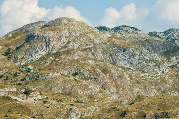 Rugged rocky mountains with scattered cabins. Durmitor National Park Montenegro
