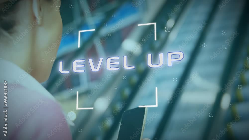 Wall mural Animation of level up text and data processing over caucasian woman using smartphone