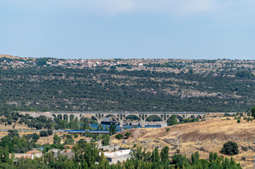 View from the wall surrounding the old town of the Spanish city of Avila (Spain) on a sunny summer morning