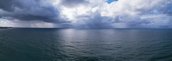 Obraz premium Storm cloudscape at sea. Aerial panorama