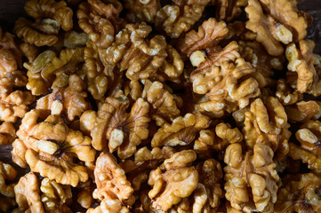 Many tasty walnuts as background, top view
