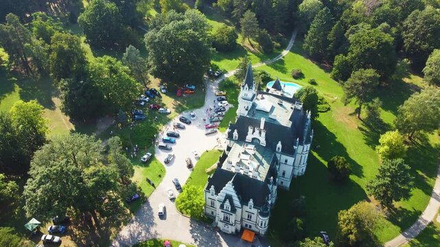 Stunning 4K drone footage of Budmerice Castle in Slovakia. Discover breathtaking aerial views of this picturesque 19th-century castle surrounded by lush greenery and beautiful gardens