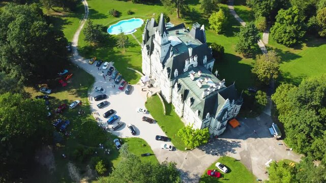 Stunning 4K drone footage of Budmerice Castle in Slovakia. Discover breathtaking aerial views of this picturesque 19th-century castle surrounded by lush greenery and beautiful gardens