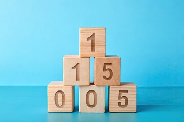 Vibrant wooden blocks with digits 10 and 5 stacked together on a pastel blue background, showcasing a playful and educational mathematical concept.