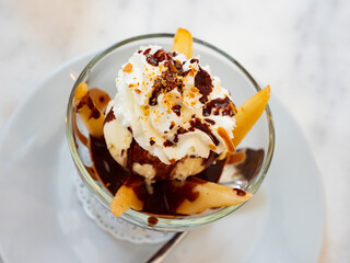 Popular French dessert Pear Beautiful Elena of vanilla pear with ice cream and chocolate sauce in a...
