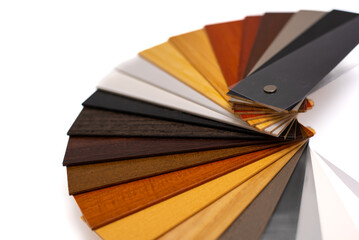 Samples of wooden blinds for windows in a store.