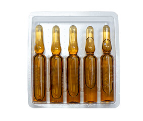 Medical brown ampoules in a box isolated on white background