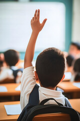 A student raising his hand with a backpack in class