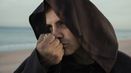Religious Monk Kisses The Rosary In Symbol Of Faith Towards Christ