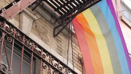 New York City building architecture, Manhattan USA. Urban residential house exterior. LGBT rainbow...