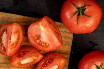 fresh soft tomatoes in drops of water