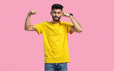 Fototapeta premium breathtaking HDR photo of Portrait of gorgeous young man raise fists wear yellow, excited TEE SHIRT isolated on pink color backgroundlora:flux_realism_lora:1>, blue jean pant, look at camera 