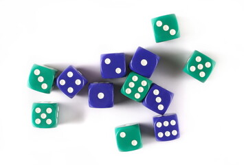 Blue and green gambling dice, macro isolated on white background, top view