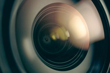 Macro photo showing the lights reflected in the camera lens.
