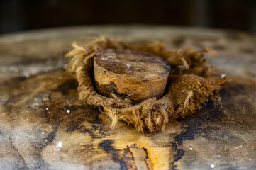 Aging process of cognac spirit in old dark French oak barrels in cellar in distillery house, Cognac...