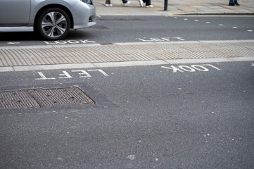 Transportation in London city, roads, road signes, street signes, warnings, indicating of directions in Great Britain, city life in England
