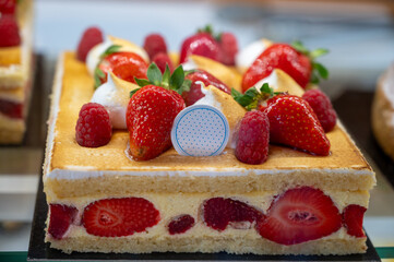 Red fruit sweet dessert cheesecake tart with fresh strawberries in bakery