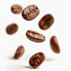 Roasted coffee beans falling on white background
