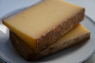 French cheese Comte, varieties unpasteurised ed milk Prestige, fruity flavoured Fruite and Vieille Reserve close up